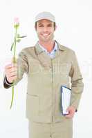 Delivery man with clipboard offering rose