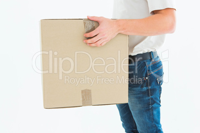 Delivery man carrying cardboard box Delivery man carrying cardboard box