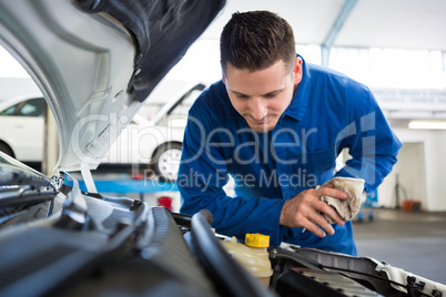 Mechanic working under the hood