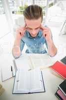 Focused businessman studying at his desk