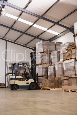 Forklift in a large warehouse