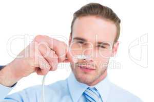 Concentrated businessman holding a cable