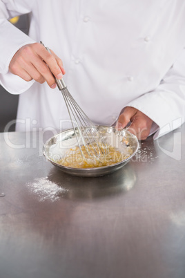 Close up of baker preparing a pastry