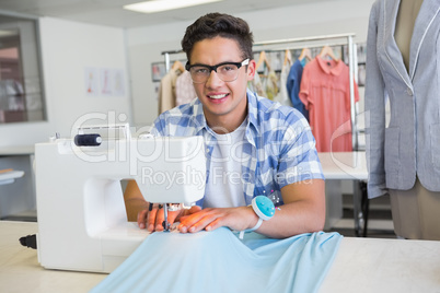 Fashion student using sewing machine