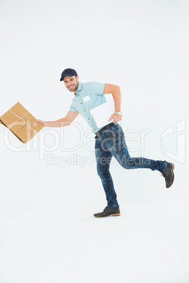 Happy delivery man running with package