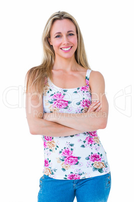 Portrait of pretty blonde posing with arms crossed