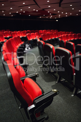 Empty rows of red seats