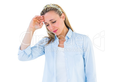 Pretty blonde woman having a headache