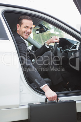 Businessman getting out the front door