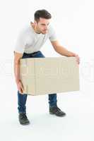 Courier man picking up cardboard box