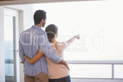 Cute couple looking out the window