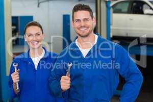 Team of mechanics smiling at camera