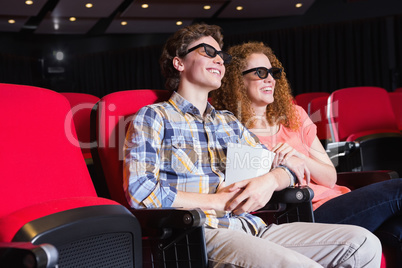 Young couple watching a 3d film