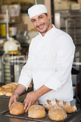 Baker checking freshly baked bread