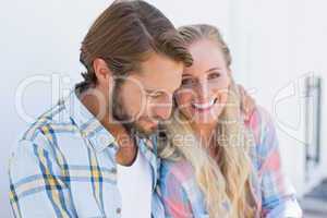 Attractive couple sitting on bench