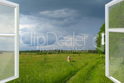 opened window to summer field before thunder