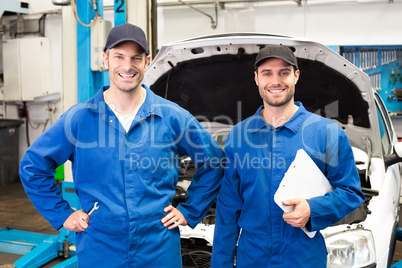 Team of mechanics smiling at camera