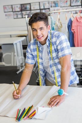 Fashion student drawing patterns