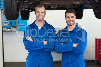 Team of mechanics smiling at camera