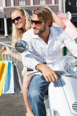 Cute couple riding a scooter