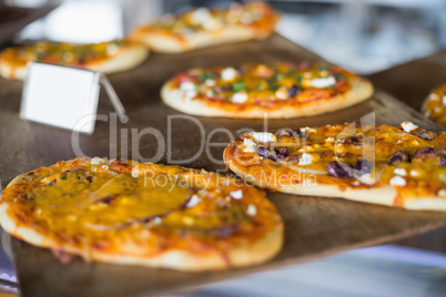 Cheesy pizza breads on tray