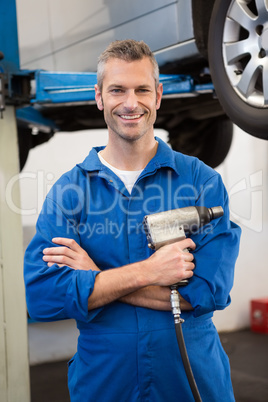 Mechanic holding a drill tool