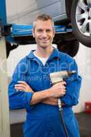 Mechanic holding a drill tool