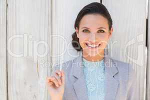 Stylish brunette thinking and smiling