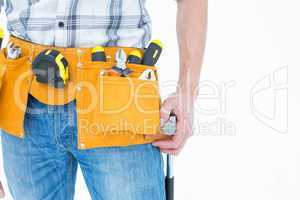 Technician with tool belt around waist