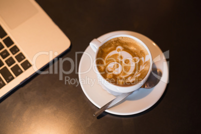 Bear design in foam of cappuccino