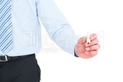 Businessman in shirt writing with a marker