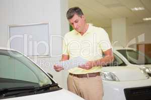 Focused customer reading a booklet