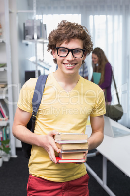 Student carrying small pile of books