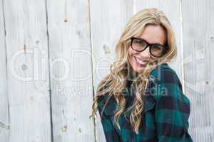 Happy blonde posing with glasses looking at camera