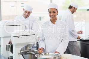 Team of bakers working at counter together