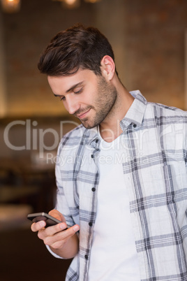 Young man sending a text