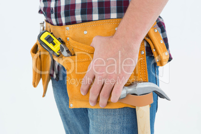 Close-up of male repairman wearing tool belt