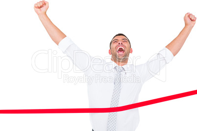 Businessman crossing the finish line