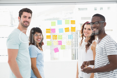 Portrait of smiling coworkers standing