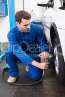 Mechanic adjusting the tire wheel