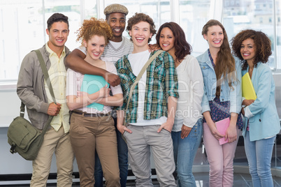 Fashion students smiling at camera together