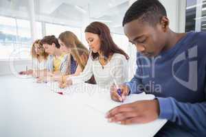 Fashion students taking notes in class