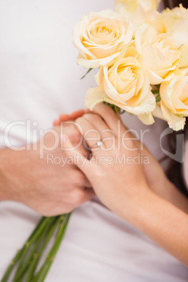 Close up of young man giving girlfriend white roses