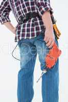 Male handyman holding drill machine