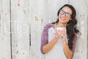 Pretty brunette holding a mug