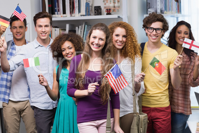 Happy students waving international flags