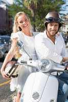 Attractive couple with their scooter