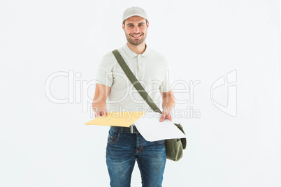 Happy courier man giving envelops