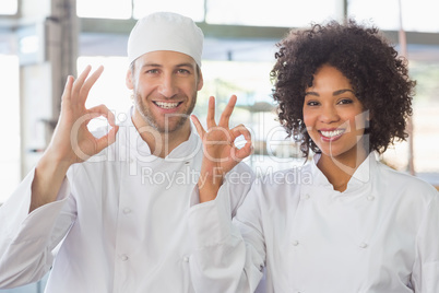 Team of bakers smiling at camera