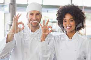 Team of bakers smiling at camera